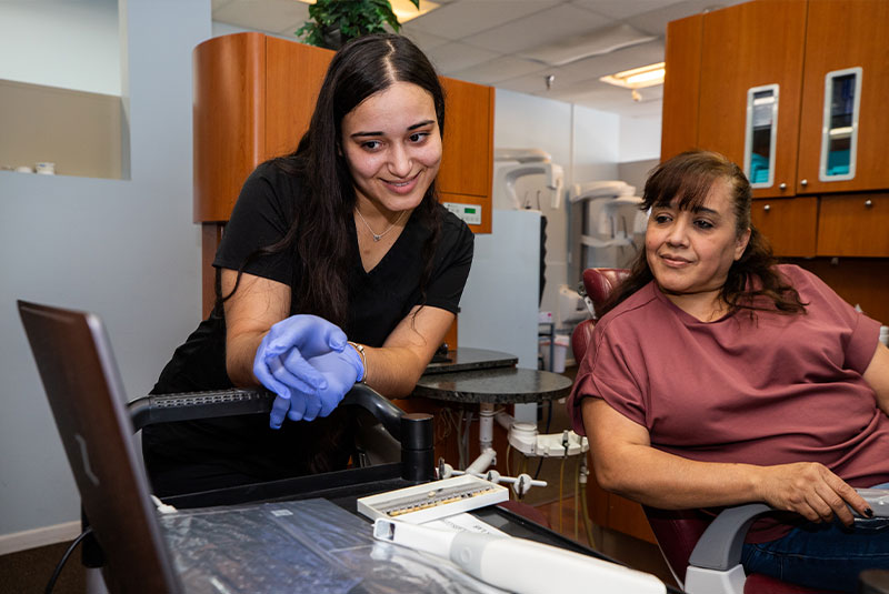dental patient smiling learning about treatment
