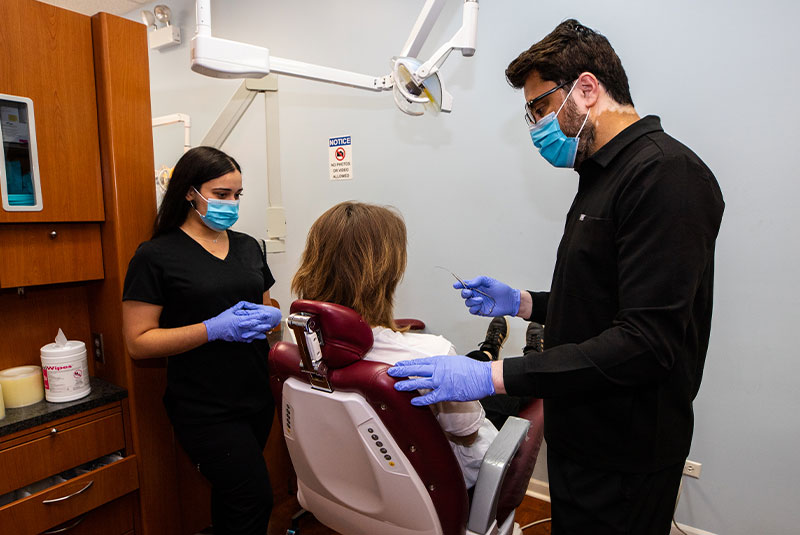Dr. Asim educating patient on braces