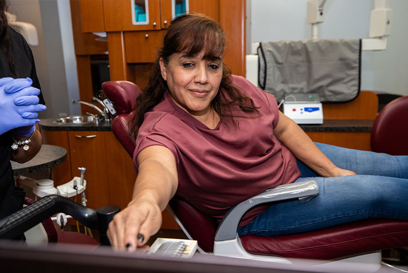 dental patient learning about her procedure