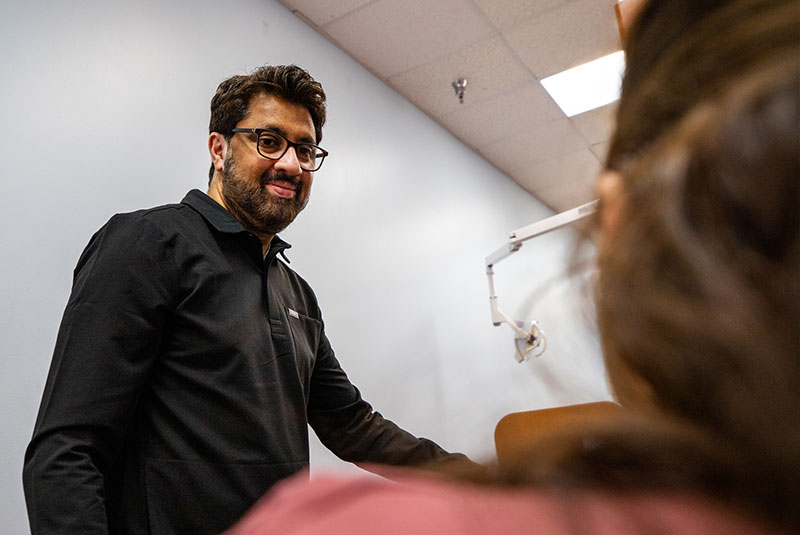 Dr. Asim talking baout fixed vs. removable dental implant options