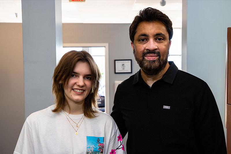 Dr. Asim smiling with orthodontic patient
