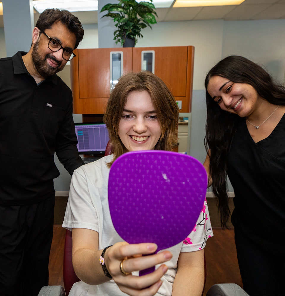 patient smiling confidently after their dental procedure