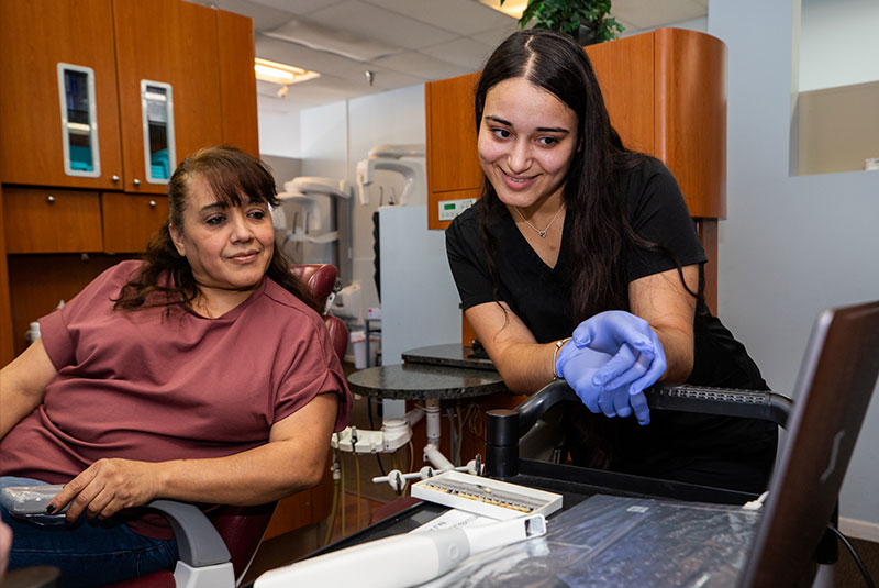 dental implant patient learning about veneers