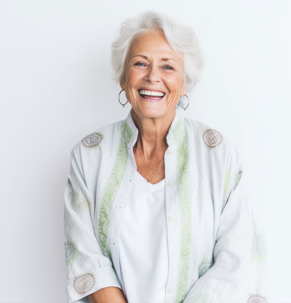 older female smiling confidently after their dental procedure